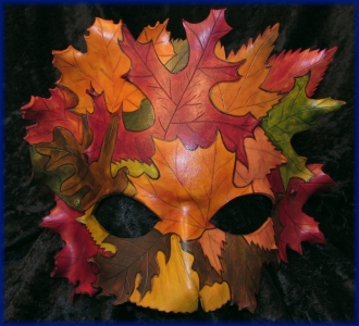 Autumn Dryad Leather Mask, a collection of diffferent leaves, forming a mask, made of one piece of leather.